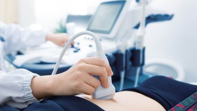 Ultrasound scan being performed